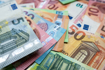 Pile of euro paper banknotes as finance background