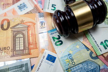 Judge hammer above  euro banknotes money. Bribe concept