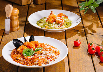 Gourmet italian pasta dishes on rustic wooden table