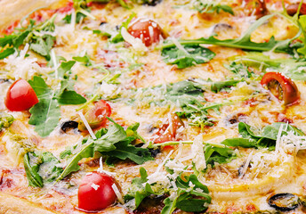 Fresh italian pizza with arugula and cherry tomatoes