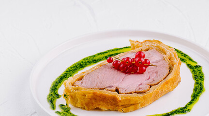 Gourmet beef wellington with berry garnish