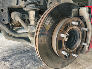 car brake disc that has deteriorated from heavy use The brake disc is scratched. and should be maintained