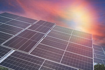 Green energy solar panel as alternative electricity source at sunset