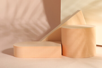 Presentation of product. Podiums and shadows on pink background