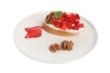 Delicious bruschetta with ricotta cheese, strawberries, mint and walnuts isolated on white