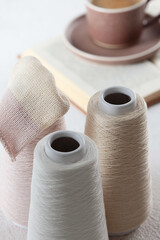 Cotton yarn. Yarn of warm tones for needlework. Knitting is like a hobby. The scheme for knitting. Light background.