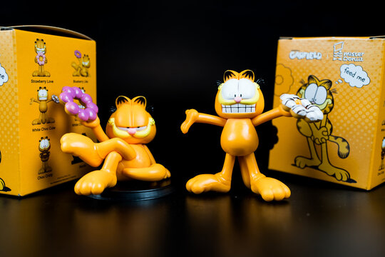 Bangkok, Thailand - July 1, 2024 : Mister Donut x Garfield. A cut toy of Garfield art toy collection