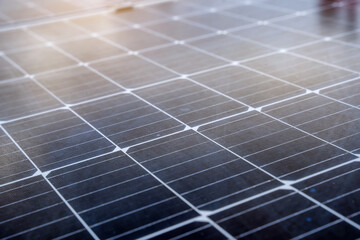 Close-up of blue solar panel landscape installed on the roof of an industrial building to produce green electricity. Sustainable resource storage and renewable energy