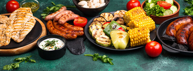 Grilled sausages, meat, and vegetables.