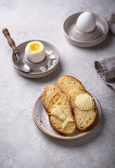 Breakfast with boiled eggs, bread and butter