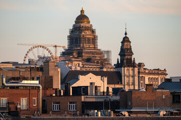 Brussels Old Town, Belgium - High angle view over the historical city center with the dome of the Court House during golden hour