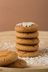 A stack of oatmeal cookies on a wooden stand. Healthy dietary oatmeal cookies. .