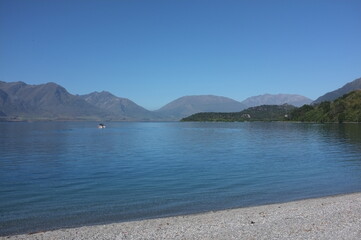 Photo of lakeside view of Lake Wakatipu or Whakatipu wai-maori and The Remarkables in Glenorchy, Otago region, South Island of New Zealand.