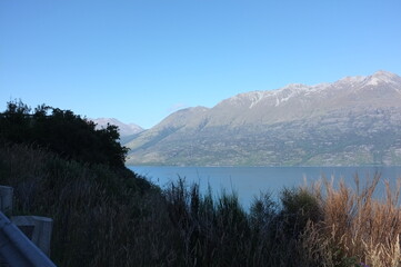 Photo of lakeside view of Lake Wakatipu or Whakatipu wai-maori and The Remarkables in Glenorchy, Otago region, South Island of New Zealand.