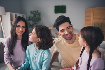 Obraz premium Photo of pretty cheerful boyfriend girlfriend kids wear casual looks embracing smiling indoors room home house
