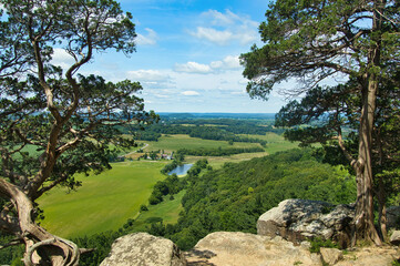 Sunny Summer day landscape of lush green fields and forests as seen from the top of Gibraltar Rock near Lodi, Wisconsin.