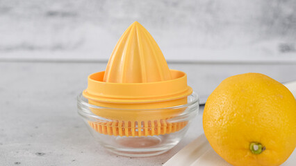 Squeezing fresh lemon. Lemon-olive oil salad dressing recipe.