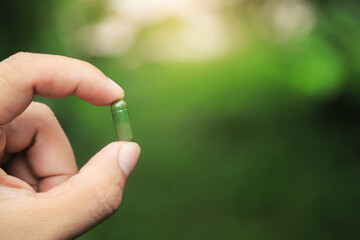 Herbal capsules from herb on hand for healthy eating in daily life