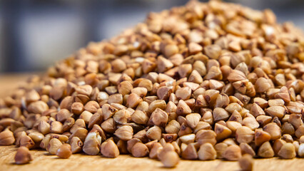 Uncooked Buckwheat Detail. Detailed view of buckwheat, highlighting texture and earthy tones, suitable for nutrition content.