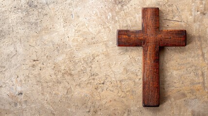 Wooden cross on textured stone background symbolizing faith and spirituality