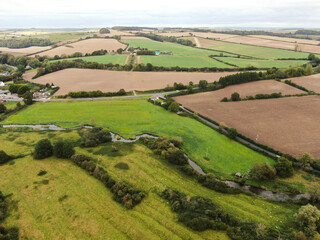 Obraz premium An aerial drones view of rolling countryside in Dorset England