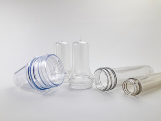 PET preform isolated on a white background, is plastic that is the result of injection before the...