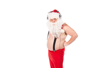 Summer and vacation. Funny Santa Claus dances and listens to music on headphones. White background.