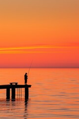 Fototapeta premium Fishermsilhouette at sunset on pier