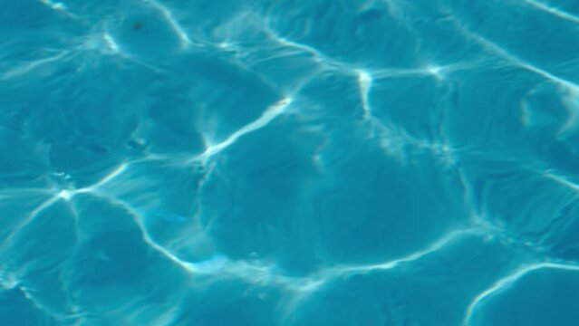 Water ripples in a pool on a sunny day