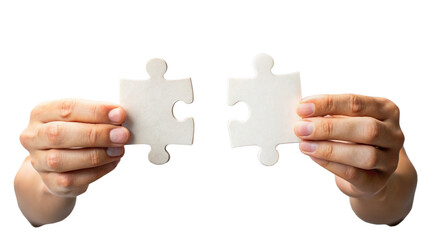 Two Hands Holding Puzzle Pieces About To Connect