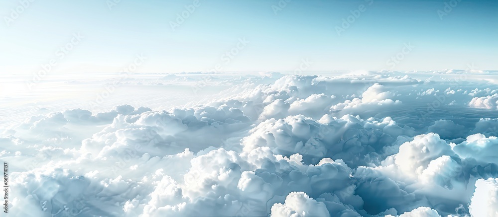 Poster Soft-focus white clouds against a blue sky form a serene backdrop with a horizontal copy space image.