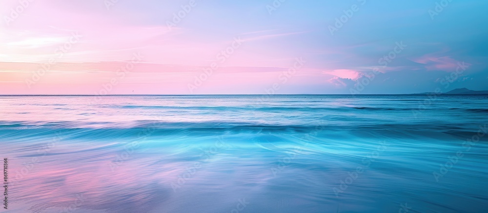 Poster seascape with a serene beach at sunset. the horizon filled with a blend of blue and pink hues, creat