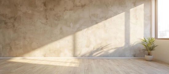 A room with a beige wall and no decoration, providing ample space for adding images or text.