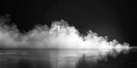 Fototapeta premium A striking black and white image of billowing smoke over a reflective surface, creating an enigmatic scene.