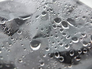 The misted and wet glass of a greenhause