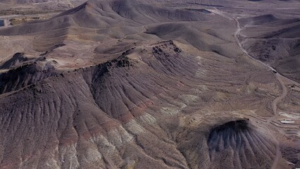 The Road Less Traveled: Pathways through the Desert,  A solitary road cuts through the heart of a...