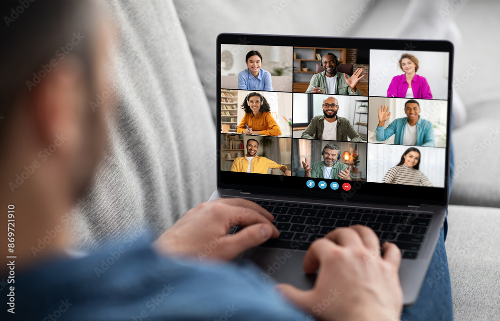 Aufkleber a man sits in a casual setting with a laptop on his lap, actively participating in a video conferenc