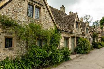 Row of cottages in Arlington, Bibury, Cotswold, was built in the late 14th century as a wool store and converted into weavers' houses in the late 17th century. 
