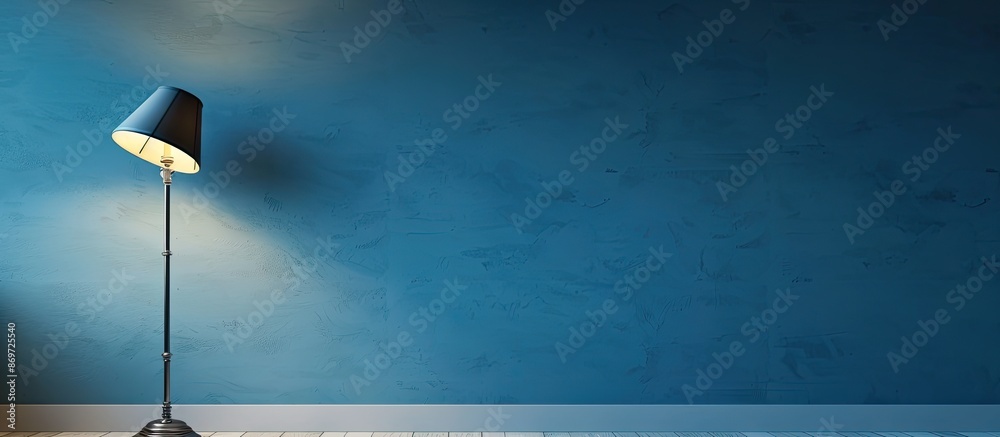 Aufkleber blue wall with a classic wall lamp, perfect for displaying text in the copy space image.
