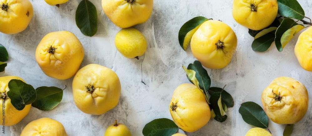 Aufkleber A beautifully arranged display of organic quinces with leaves on a bright table in a flat lay style, offering ample copy space image.