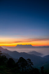 Doi Luang Chiang Dao misty mountain landscape at morning in cloudy sunrise sky 