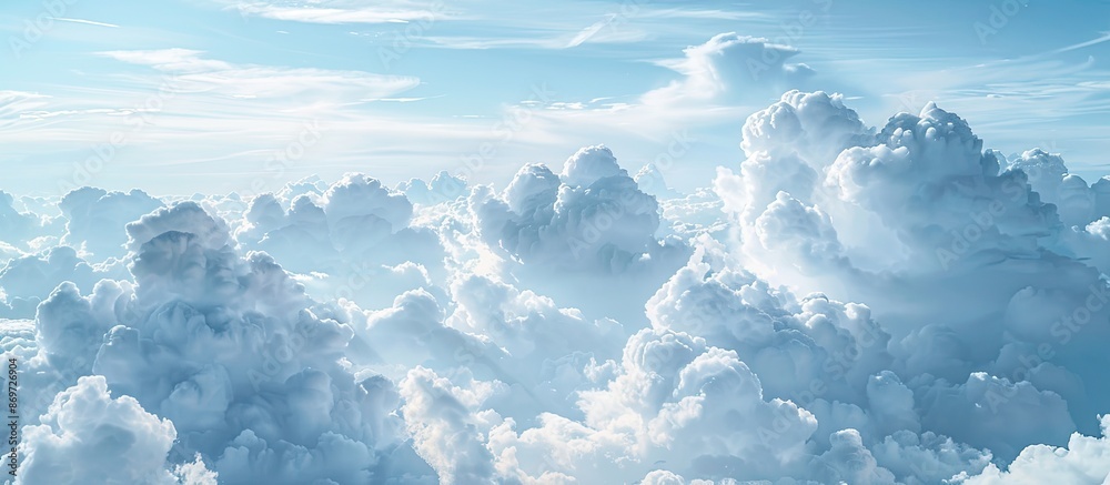Poster Blue sky with fluffy white clouds, perfect as a copy space image for adding text.