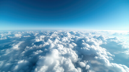 Naklejka premium Bird's-eye view of a blanket of clouds beneath a clear blue sky