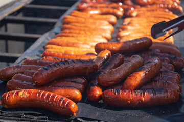 Grilled sausage. Refreshments at the sales market.
