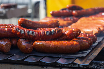 Grilled sausage. Refreshments at the sales market.