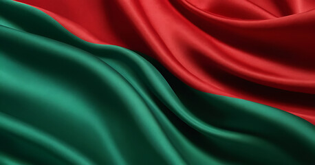 Close-up of red and green fabric with a silky texture, resembling the Belarusian flag. Ideal for political, cultural, or textile-themed content.