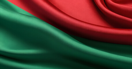 Close-up of red and green fabric with a silky texture, resembling the Belarusian flag. Ideal for political, cultural, or textile-themed content.