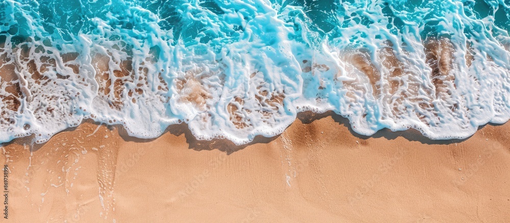 Poster a tranquil ocean wave on a sandy shore, perfect for a summer holiday backdrop with ample copy space 