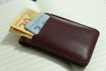 Brazilian real banknotes in a wallet