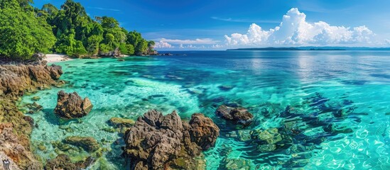 Stunning coastal view with clear turquoise waters offers a serene setting for a relaxing holiday with a magnificent copy space image.